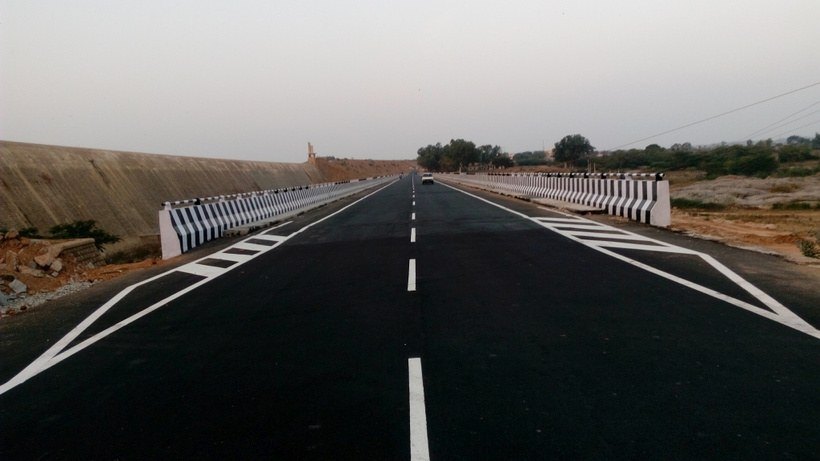 Completed National Highway carriageway with new markings and crash barriers